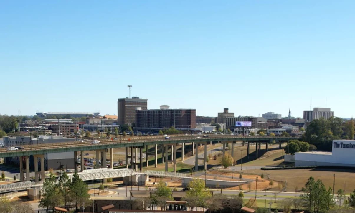 Downtown Tuscaloosa skyline and riverfront district on a clear day